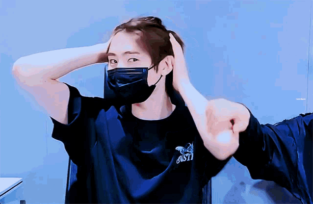 a man wearing a mask and a shirt that says 1871 on it