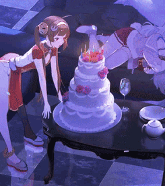 a purple and white cake with candles on it