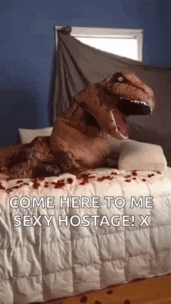 a t-rex costume is sitting on top of a bed with roses .