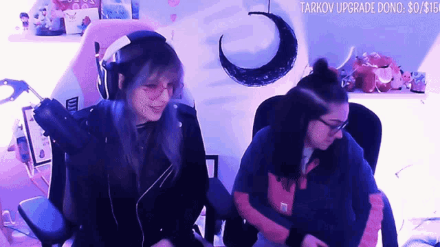 two girls are sitting in front of a purple wall with the words tarkov upgrade done on the bottom