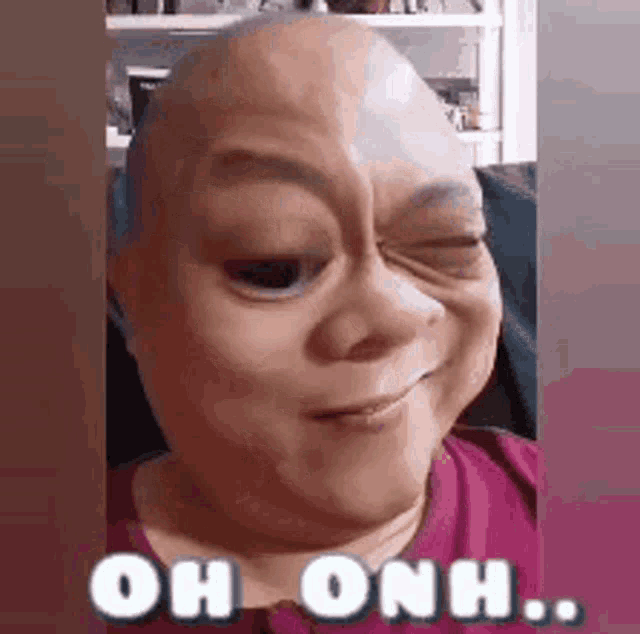 a woman with a mask on her face is making a funny face and winking .