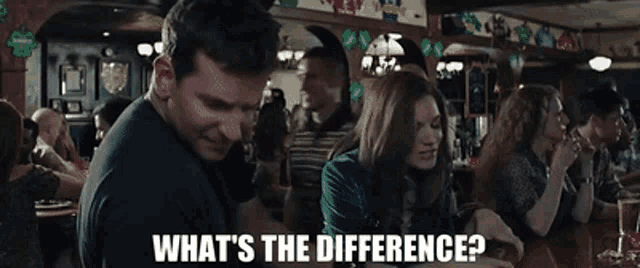 a man and a woman are sitting at a table in a bar with the words what 's the difference written below them