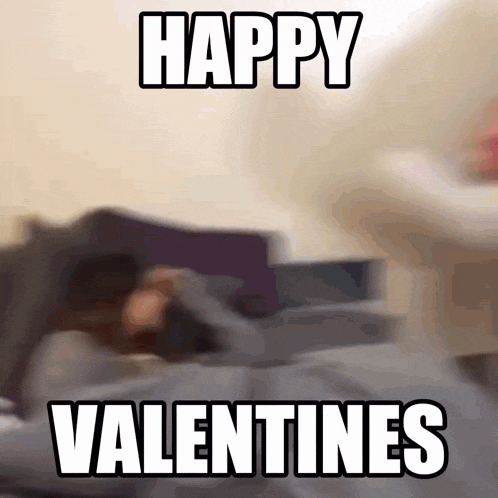 a blurred image of a person laying on a bed with the words happy valentines below them