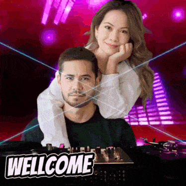 a man and a woman are standing in front of a mixer with the words wellcome on the bottom