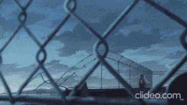 a chain link fence with the website clideo.com on the bottom right