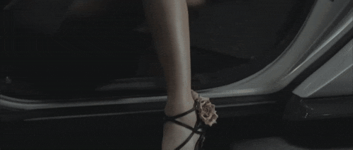 a close up of a woman 's torso in a black dress
