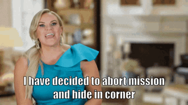 a woman in a blue dress is talking about abortion