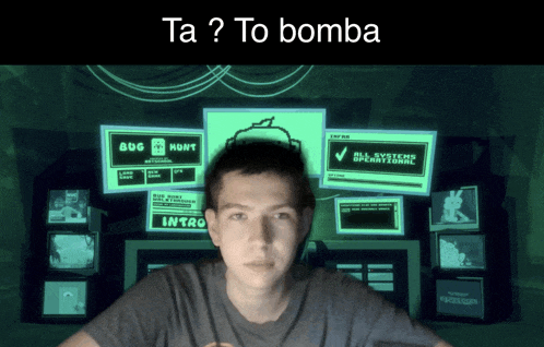 a man is sitting in front of a screen that says ta to bomba