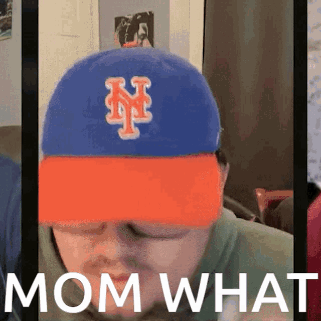 a man wearing a new york mets hat says " mom what "