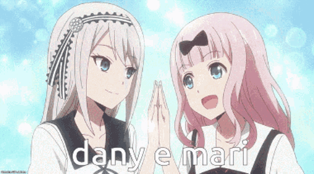 a couple of anime girls are standing next to each other with the words dany e mari written on the bottom