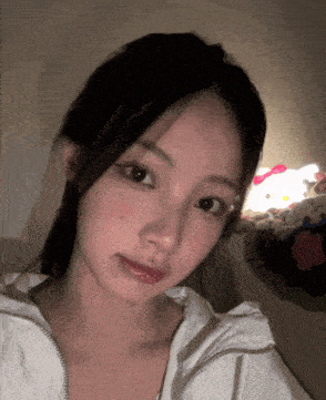 a close up of a girl taking a selfie