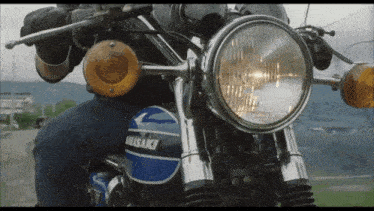 a kawasaki motorcycle is parked on the side of a road