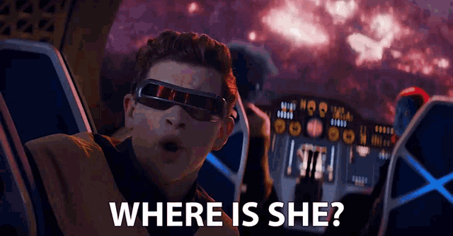 a man in a spaceship with the words " where is she " below him