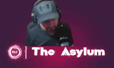 a man covering his face with his hands in front of the asylum logo