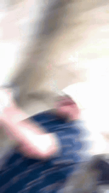 a blurry picture of a person 's face with a white background
