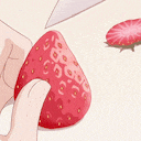 a person is cutting a strawberry with a knife ..