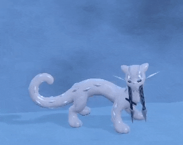 a white cat with a sword in its mouth is standing on a blue background .