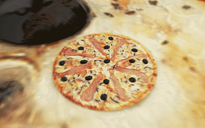 a pizza with ham mushrooms and black olives on a table