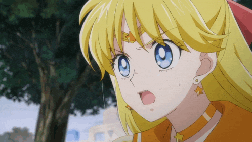 a close up of a girl 's face with a star on her forehead