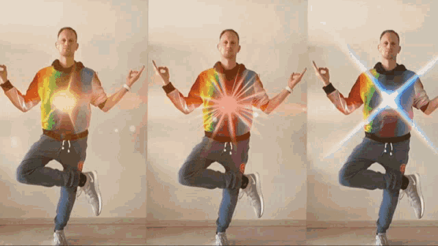 a man in a tie dye shirt is dancing in front of a wall