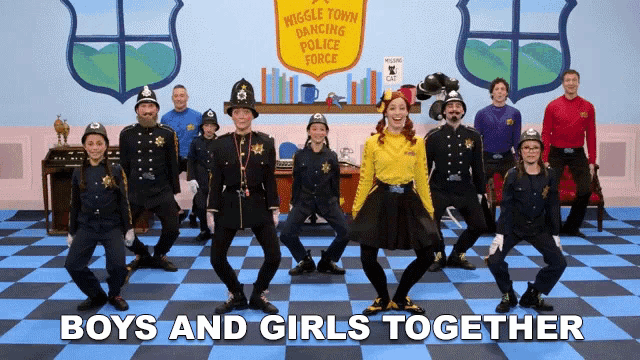 a group of children in police uniforms are dancing together