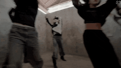 a group of people are jumping in the air with the letter s on the bottom left