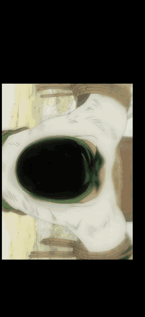 a person with a green scarf around their neck is laying down