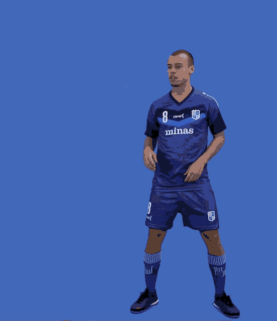 a soccer player wearing a blue shirt that says minas on it