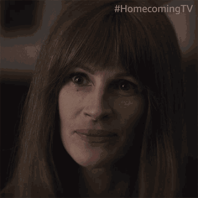 a close up of a woman 's face with the hashtag homecoming tv