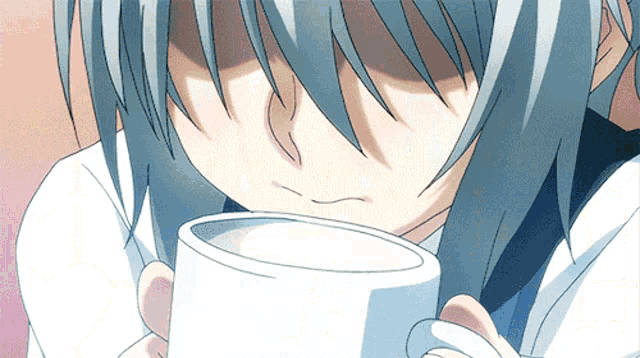 a person with gray hair is drinking from a white mug