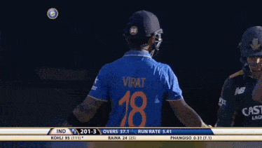 a cricket player holds his bat up in the air while playing against india