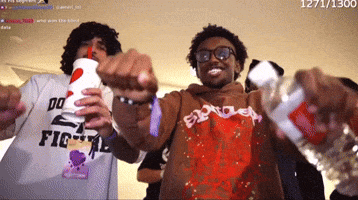 a man wearing a shirt that says do n't fight is holding a bottle of water