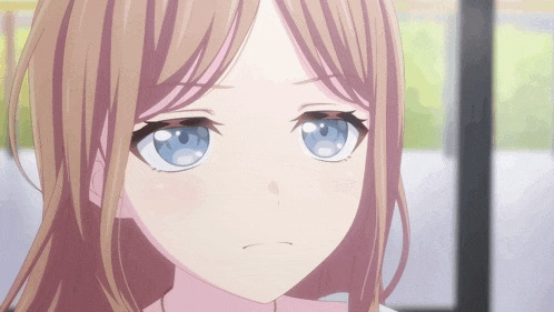 a close up of a girl with blue eyes and brown hair