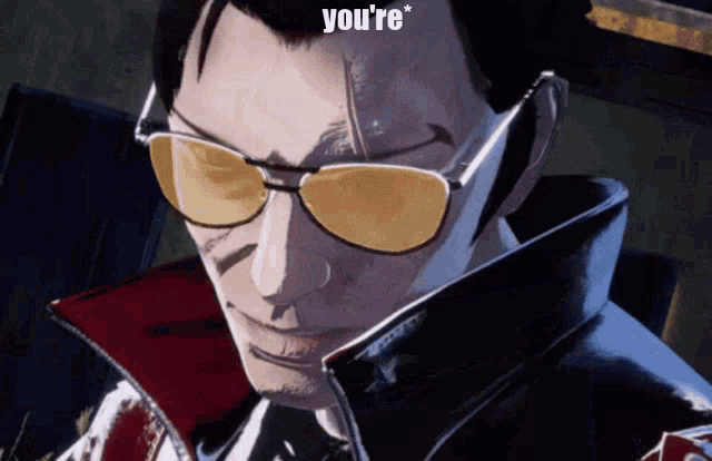 a man wearing sunglasses says " you 're " on the top of his head