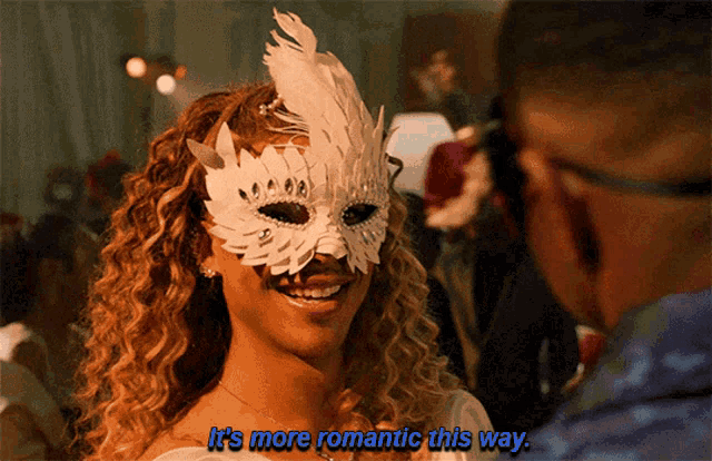a woman wearing a mask says it 's more romantic this way while looking at a man