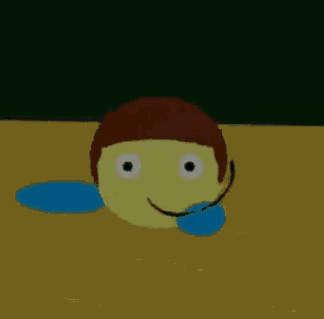 a cartoon character is sitting on a wooden table with a smiley face .