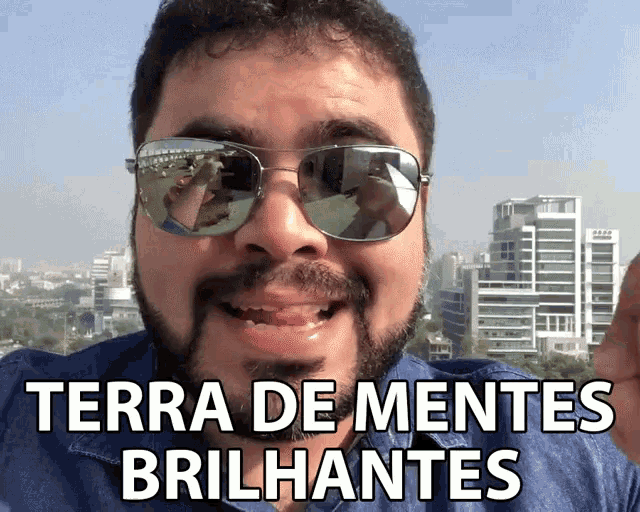 a man wearing sunglasses with terra de mentes brilhantes written on the bottom
