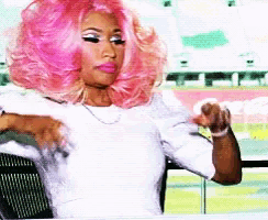 a woman with pink hair is wearing a white top