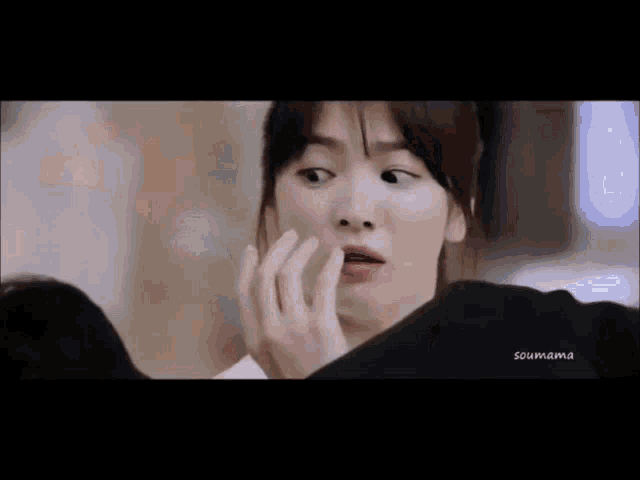 a close up of a woman making a funny face