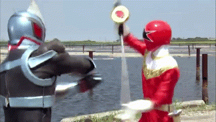 two power rangers are standing next to each other and one is wearing a red helmet