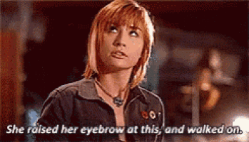 a woman in a denim jacket is saying she raised her eyebrow at this , and walked on .