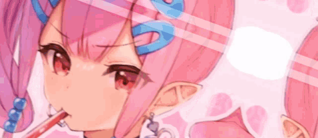 a close up of a girl with pink hair drinking through a straw .