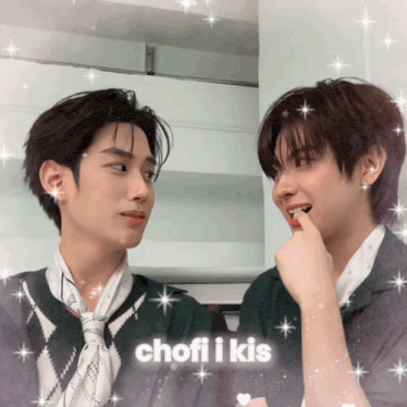 two young men are looking at each other with the words chofi i kis written on the bottom