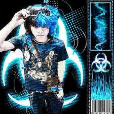a boy with blue hair and goggles is wearing a t-shirt with a picture of a man on it .