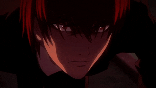 a close up of a person 's eye with a red light coming out of it