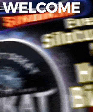 a sign that says welcome on it in white letters