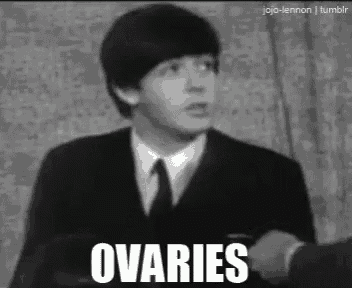 a man in a suit and tie is saying ovaries in a black and white photo
