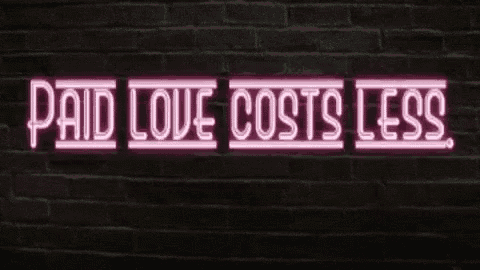 a neon sign says paid love costs less on a brick wall