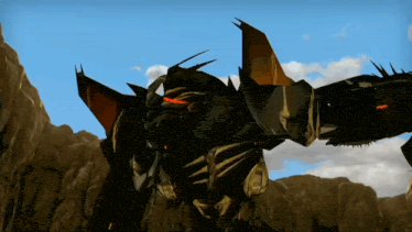a robot is standing in front of a mountain with a blue sky behind it .