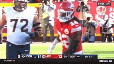 a football game between denver and kansas city